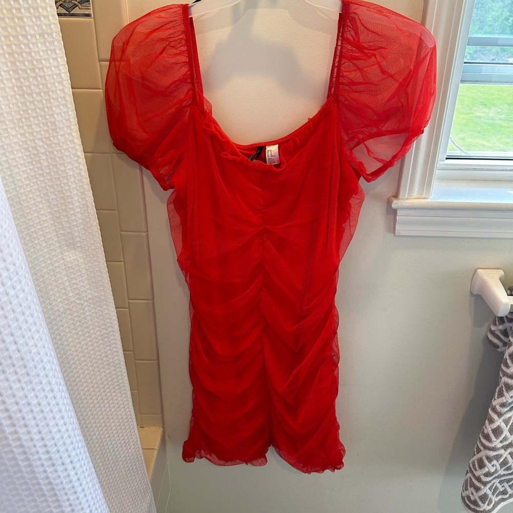 Red, mini dress. Ruffles. Never worn. Size large new with tags